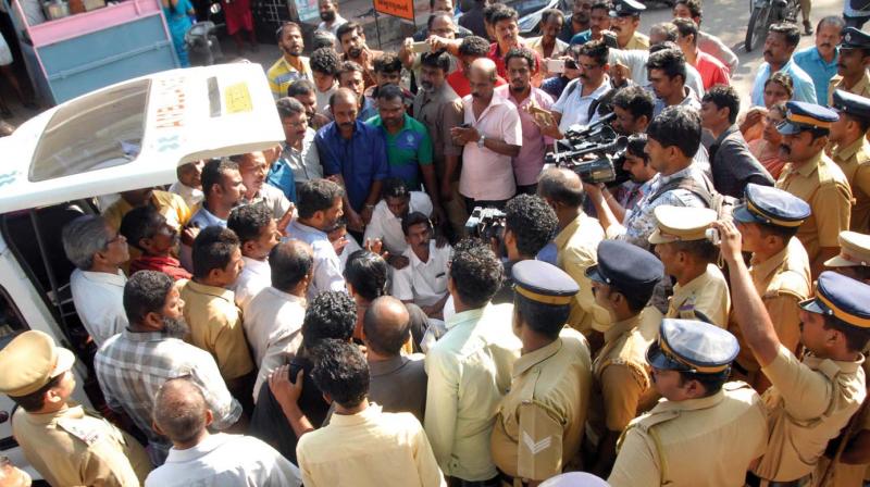 Family and relatives of a girl, who died at Karuvelipady government hospital on Wednesday allegedly due to medical negligence, conduct a protest in front of the hospital. 	(Photo: DC)