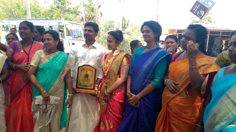Thiruvananthapuram collector K. Vasuki with the couple.