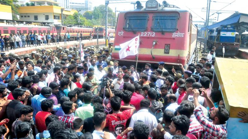 DYFI activists block Kerala Express at the Thiruvananthapuram central railway station.