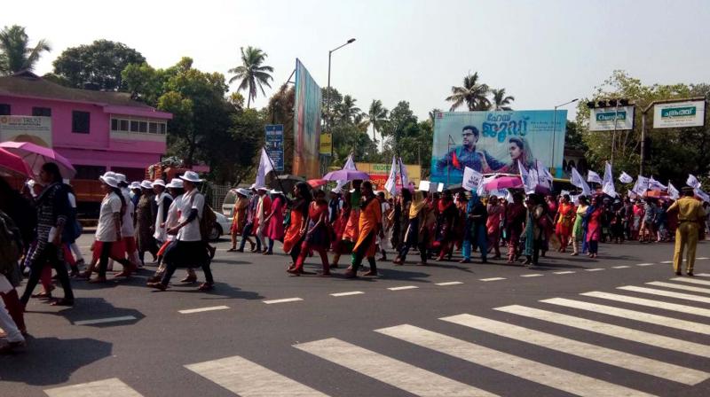 Nurses under UNA take out a rally on the National Highway in front of KVM hospital Cherthala on Thursday.