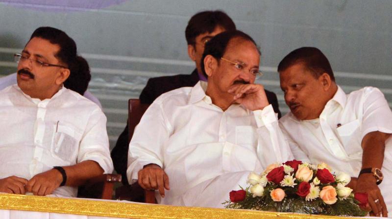 P.V. Abdul Wahab, MP, has a word with Vice-President M. Venkaiah Naidu at the valedictory function of platinum jubilee celebrations of Farook Rouzathul Uloom Association and Arabic College at Farook College in Kozhikode on Saturday. Minister for welfare of minorities K.T. Jaleel looks on.	(Photo: DC)