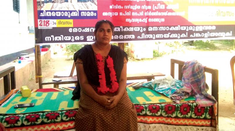 Preetha Shaji, a homemaker, on a hunger strike at Pathadipalam near Edappally in Ernakulam on Sunday. 	BY ARRANGEMENT