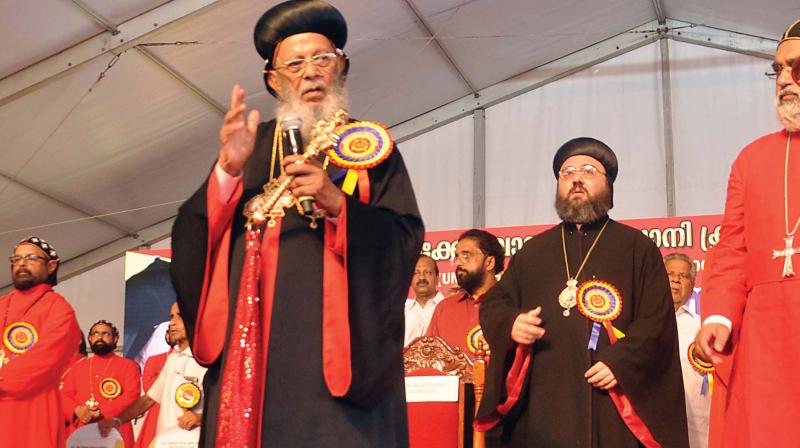 Catholicos Baselios Thomas I greets followers along with Patriarchal Vicar of Belgium, France and Luxembourg Mor George Kourieh during Jacobite Syrian Christian Churchs faith declaration convention in Kochi on Sunday.	(Photo: SUNOJ NINAN MATHEW)