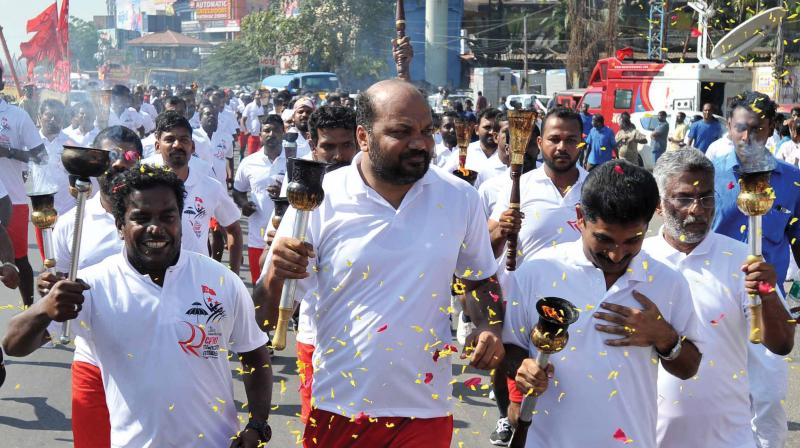 Actor Manikandan, CPM district secretary P. Rajeev, M. Swaraj, MLA and John Fernandes, MLA at the torch light procession as part of state CPM state conference in Kochi on Tuesday. 	(Photo: DC)