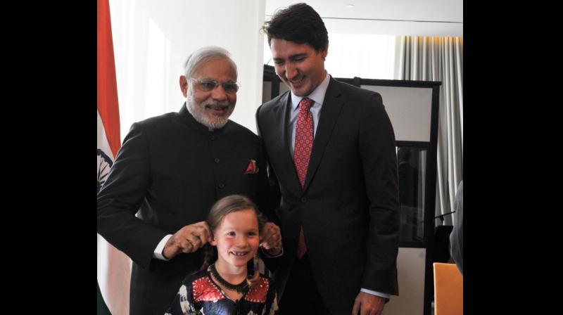 Prime Minister Narendra Modi tweeted a picture from his 2015 Canada visit, when he had met Canadian Prime Minister Justin Trudeau and his daughter Ella-Grace. (Photo: Twitter | @narendramodi)