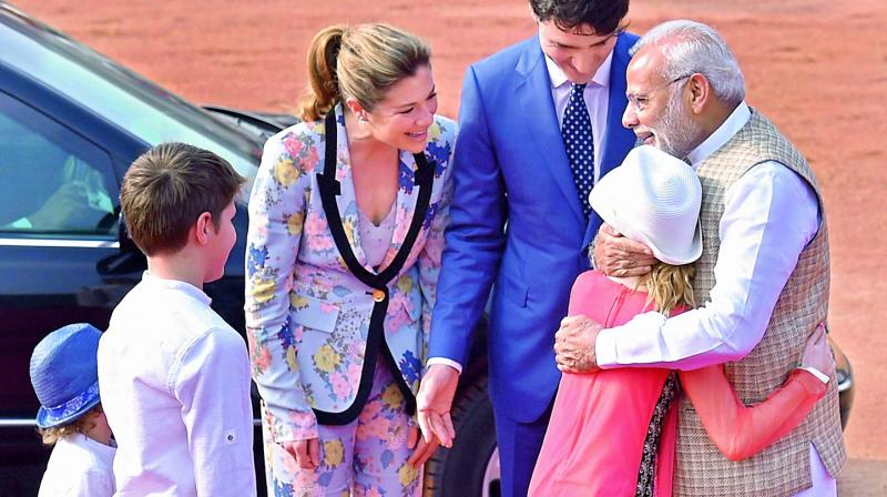 Prime Minister Narendra Modi hugs Ella-Grace Margaret, Canadian Prime Minister Justin Trudeaus daughter at Rashtrapati Bhawan on Friday. 	(Photo: PTI)