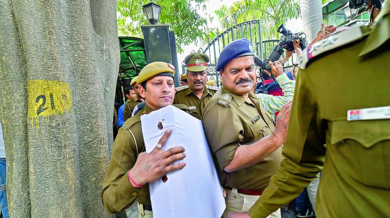 Police collect evidences from Delhi Chief Minister Arvind Kejriwals residence during an investigation in relation to the alleged assault on chief secretary Anshu Prakash by AAP MLAs, in New Delhi on Friday. (Photo:  PTI )