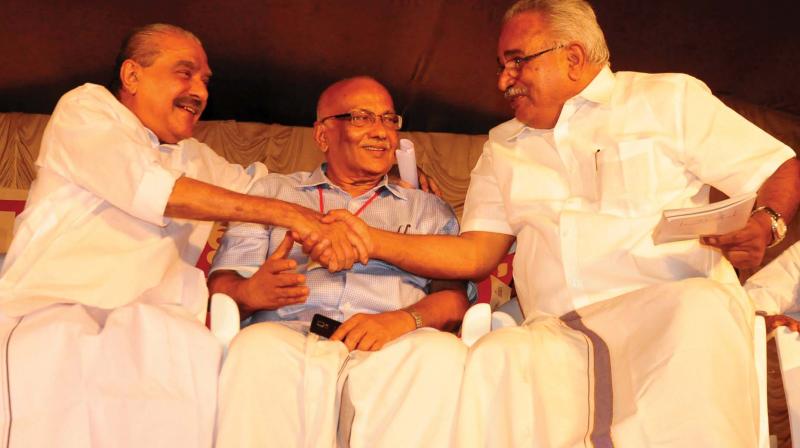 K.M. Mani greets CPI state secretary Kanam Rajendran during the seminar Keralam Ennale Ennu Nale. CPM leader S. Ramachandran Pillai is also seen. 	(Photo: Anup K. Venu)