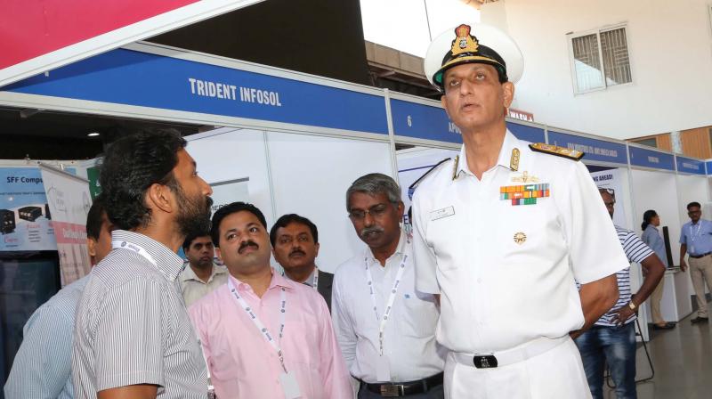 Vice Admiral A.R. Karve takes a look at one of the pavilions of the technology exhibition held as part of the ICONS-2018.