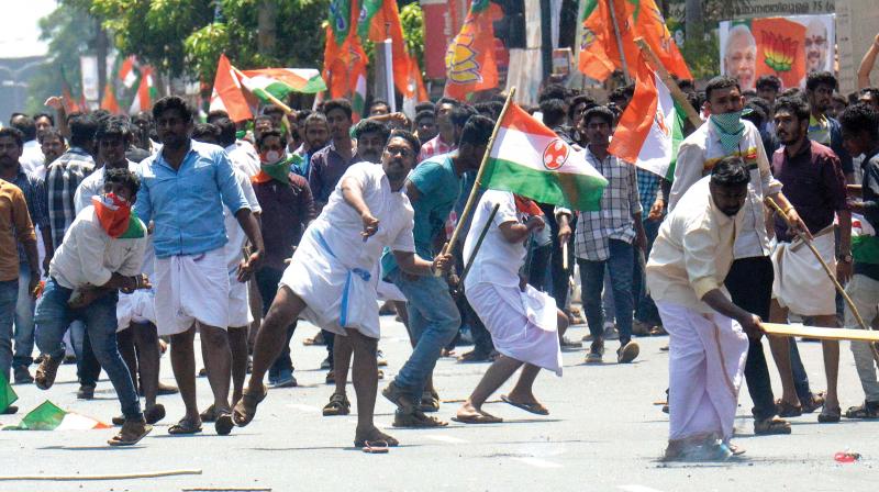 Youth Congress workers hurl stones at the police after their protest turned violent in Thiruvananthapuram on Monday. 	(Photo: PEETHAMBARAN PAYYERI)