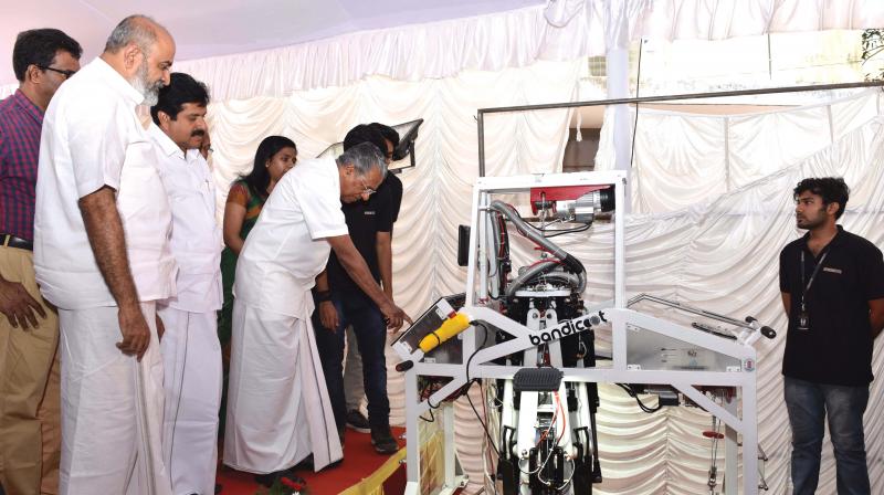 Chief Minister Pinarayi Vijayan inaugurates Bandikoot, the drainage cleaning robot in presence of Irrigation minister Mathew T Thomas and V.S. Sivakumar, MLA, on Monday.