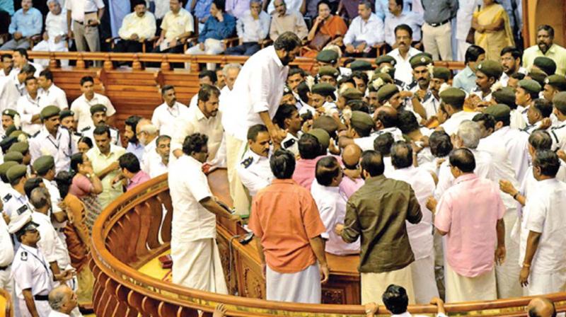 LDF MLAs on a rampage destroying Speakers podium and indulging in a scuffle with the watch-and-ward staff when former finance minister K.M. Mani, facing charges in bar bribery scam, was to present the state budget. 	 FILE
