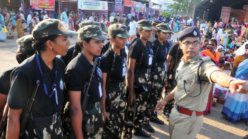 Women commandos being briefed at the Attukal temple premises in Thiruvananthapuram on Thursday.  (Photo: A.V. MUZAFAR)