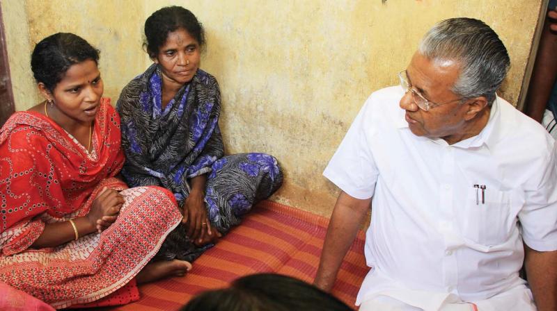 Chief Minister Pinarayi Vijayan on Friday calls on mother and sister of the tribal youth Madhu, who was lynched by a mob in Attappady. 	(Photo: DC )