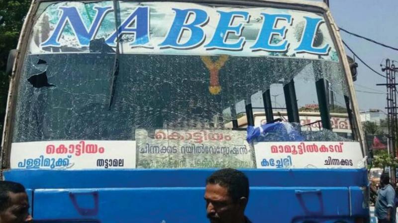 A bus with a shattered windshield which was damaged in stone pelting by KSU activists on Friday.