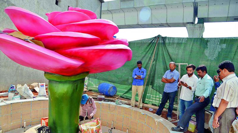 Workers give final touches to the citys first rose garden. The garden was inaugurated by deputy mayor Baba Fasiuddin as part of the junction beautification programme at Lakdikapool.