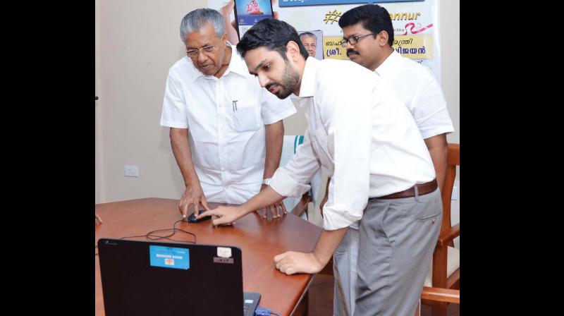 Chief Minister Pinarayi Vijayan launches mobile app WeAreKannur in the presence of district collector Mir Muhammed Ali and K.K. Ragesh MP 	(Photo:  PRD)