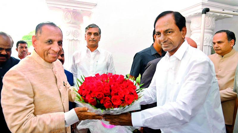 Telangana Chief Minister K. Chandrasekhar Rao welcomes Governor of Telangana and Andhra Pradesh E.S.L Narasimhan on Sunday.