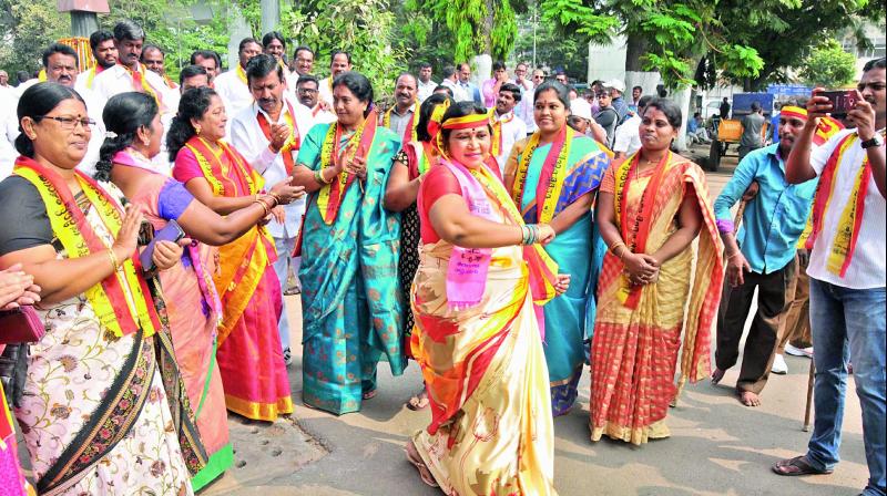 TRS women party workers dance during the  Rajya Sabha candidate nominations at Gun Park in Hyderabad on Monday. (Photo:  P. Surendra)