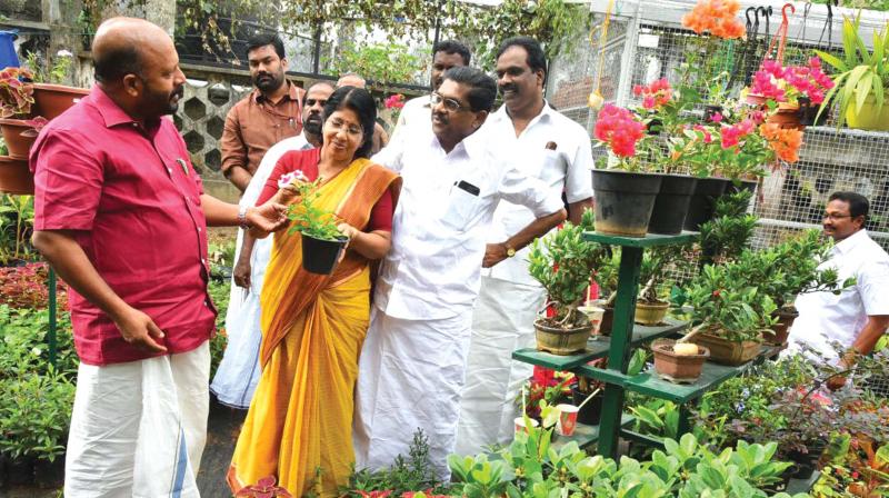 Agriculture minister V. S. Sunil Kumar appreciates the plants at Saugandhikam Gardens belonging to Latha Sudheeran, wife of former KPCC president V.M. Sudheeran, at Thiruvananthapuram on Tuesday.