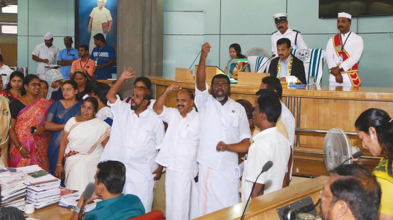 UDF councillors protest during the council meeting on Tuesday.