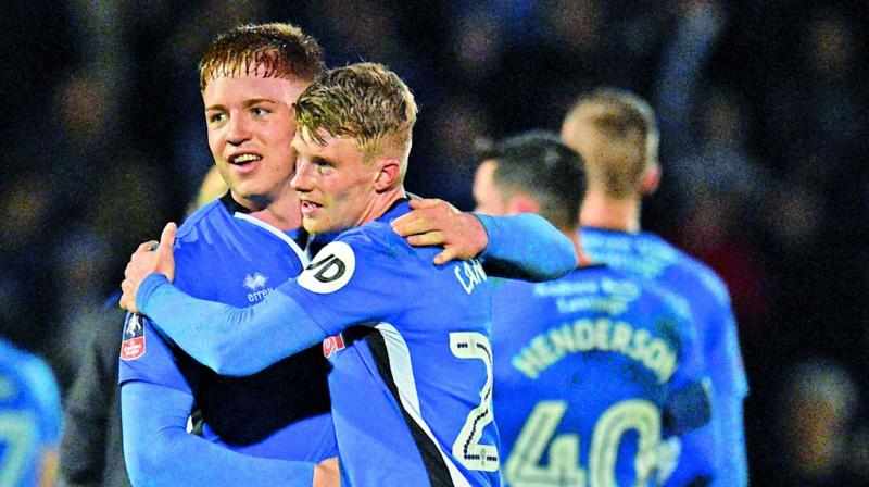 Rochdales Oliver Rathbone (left) and Andy Cannon after the 2-2 draw against Tottenham in their FA Cup fifth round match in Rochdale on Sunday. (Photo: AFP)