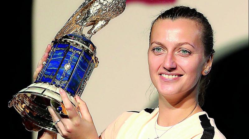 Petra Kvitova of the Czech Republic poses with her trophy after winning womens singles final at the Qatar Open tennis tournament in Doha on Sunday. (Photo: AFP)
