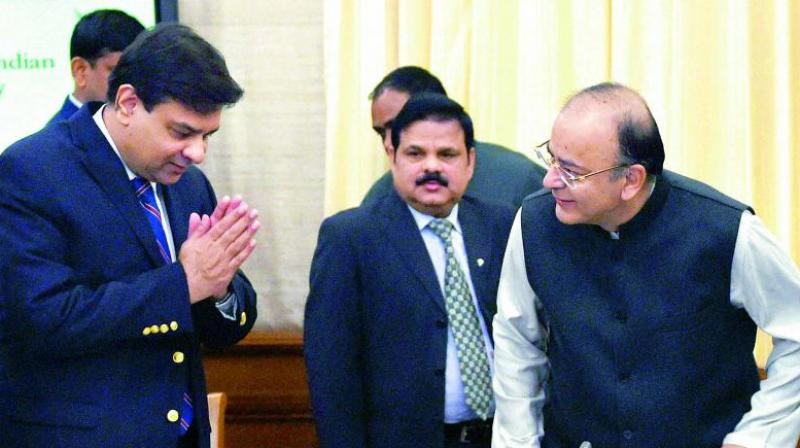 RBI governor Urjit Patel greets Finance Minister Arun Jaitley at an event. (Photo: PTI)