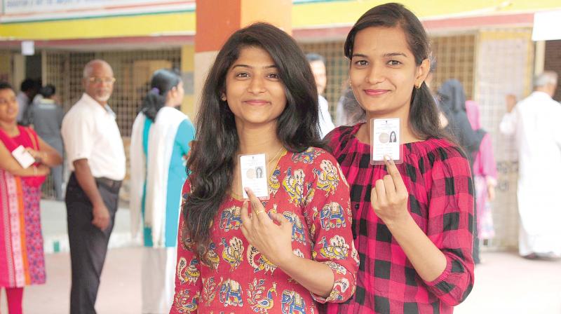 Voters posing with their ID cards during the recent  election. Photograph used for representative purposes only.