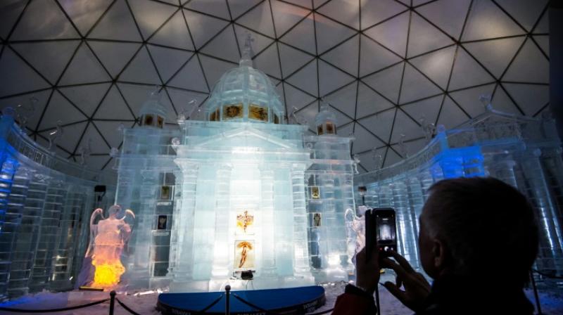 Sculptors flock to the Slovak Tatra mountain hamlet of Hrebienok every winter to build an ice version of a famous church. (Photo: AFP)