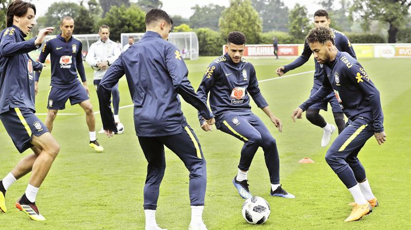 Brazil players train in London on Tuesday. (Photo: AP)