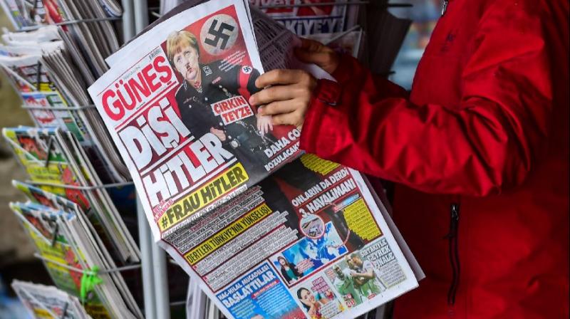Turkish daily depicts Merkel as Frau Hitler on front page (Photo: AFP)