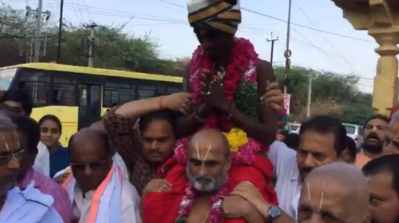 CS Rangarajan of Chilkur Balaji Temple carried Aditya Parasri into the sanctum sanctorum (Photo: Facebook)