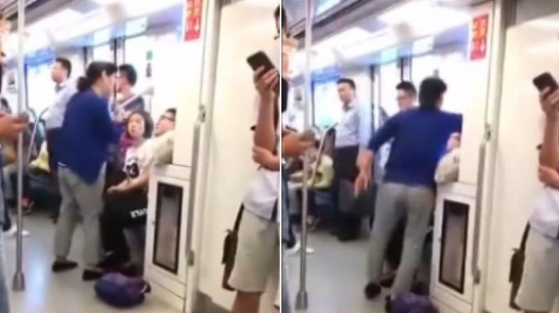Elderly woman sits on man after he refuses to give up seat on train. (Photo: Youtube)
