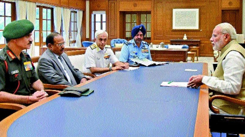 Prime Minister Narendra Modi in a meeting with the heads of the security forces in New Delhi on Tuesday. 	(Photo:PTI)