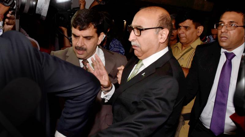 Pakistans High Commissioner Abdul Basit leaves after attending a programme of Centre for Peace and Progress in New Delhi. (Photo: PTI)