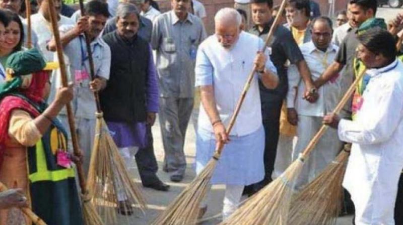PM Narendra Modi sweeping streets at the launch of the Swachchh Bharat Abhiyan four years ago.