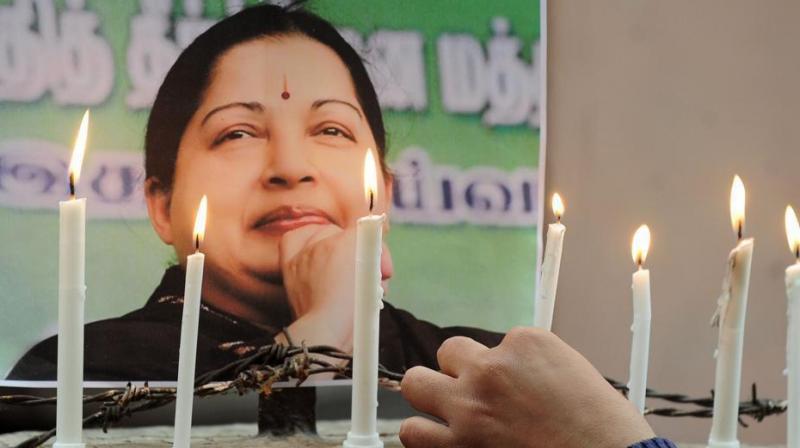 Supporters of former Tamil Nadu chief minister J Jayalalithaa pay tribute to her inâ€‰Chennai. Jayalalithaa died inâ€‰December last year. (Photo: AFP | File)