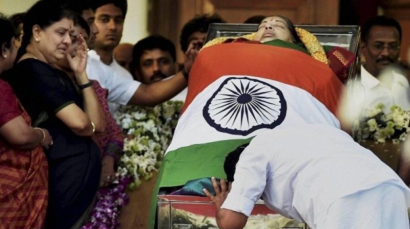 Prior to Jayalalithaas burial, her body was brought from the hospital to the Poes Garden residence. (Photo: PTI)