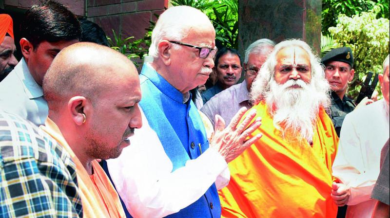 Senior BJP leader L.K. Advani with (Right) Ram Vilas Vedanti and (Left) Uttar Pradesh Chief Minister Yogi Adityanath at the VIP guest house in Lucknow on Tuesday.  (Photo: PTI)