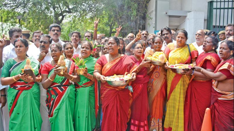 AIADMK womens cadres perform special prayers outside Apollo Hospital in Chennai for the speedy recovery of   J. Jayalalithaa on Friday. (Photo: DC)