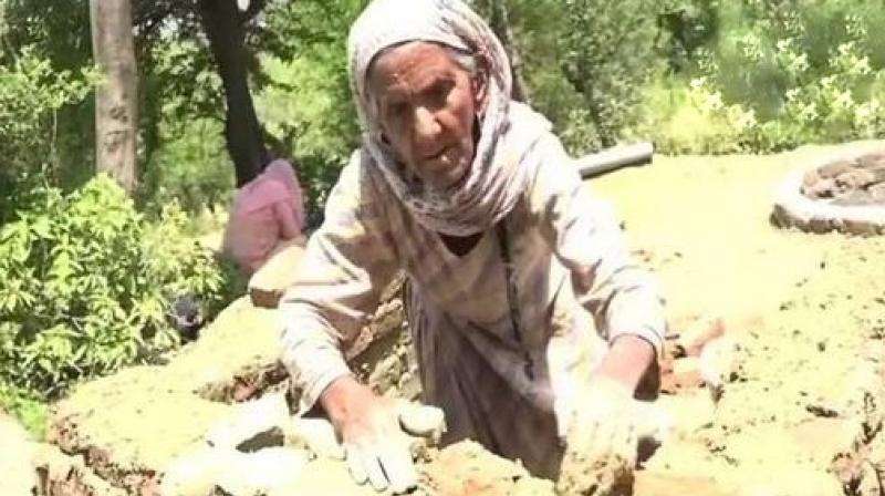 87-year-old woman from Jammu and Kashmirs village, Rakkhi says she wants to see her village open defecation free. (Photo: ANI)