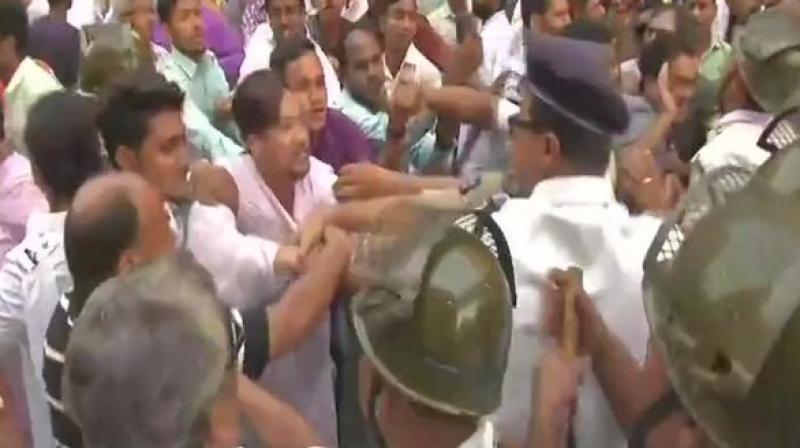 A clash erupted between the Congress workers and police in Kolkata on Friday as the party staged a protest over rotten meat supply racket. (Photo: ANI)
