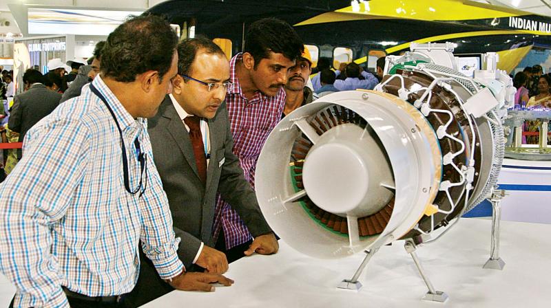 People at various stalls at the event, at Yelahanka Airforce Station, in Bengaluru on Friday. (Photo: Shashidhar B.)