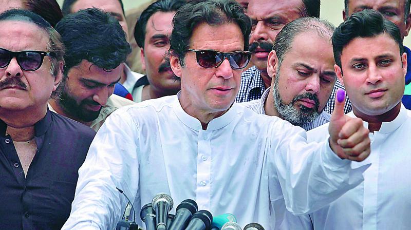 Imran Khan, chief of Pakistan Tehreek-e-Insaf party, after casting vote in Islamabad on Wednesday. (Photo: AP)