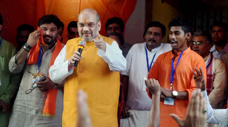 BJP National President Amit Shah addressing booth level workers at Bhawanipore Constituency in Kolkata on Wednesday. (Photo: PTI)