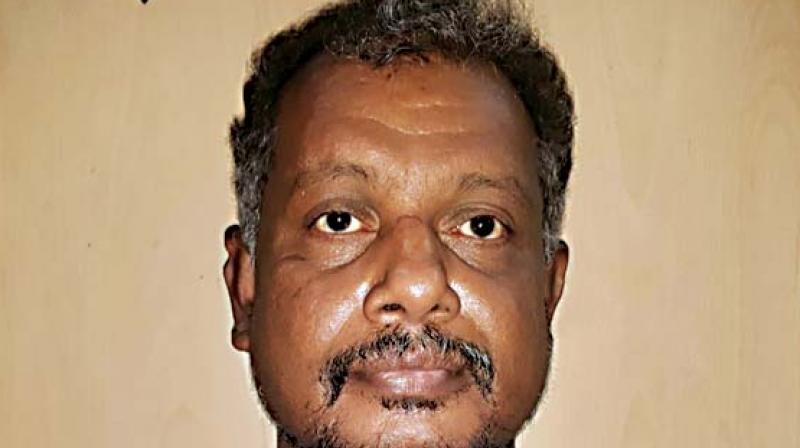 The accused has been identified as T.F. Hadimani, a resident of Vijayanagar in Mysuru.