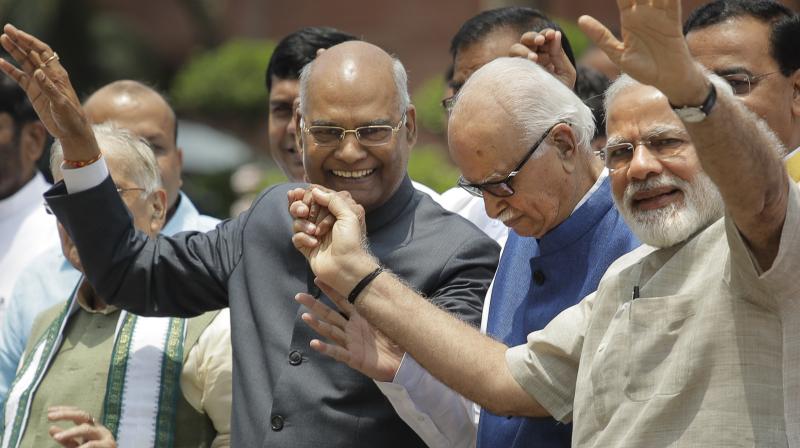 Indian Prime Minister Narendra Modi, right, Bharatiya Janata Party senior leader L.K.Advani, second right, and ruling National Democratic Alliances presidential candidate Ram Nath Kovind. (Photo: AP)