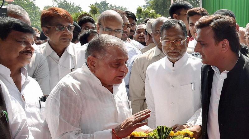 Samajwadi Party supremo Mulayam Singh Yadav, Uttar Pradesh Chief Minister Akhilesh Yadav and partys UP state president Shivpal Yadav at the inauguration of \Samajwad ka Sangarahalaya\ at Jai Praksh Narayan Antarrashtriya Kendra in Lucknow. (Photo: PTI)