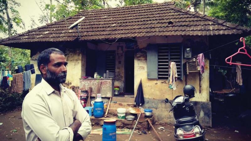 K.S Antony from Vellottumpuram standing in front of his house.